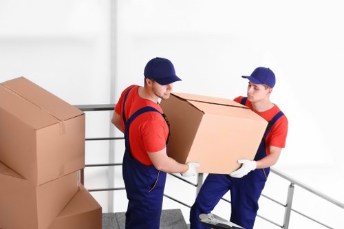 Loading furniture and boxes into a van for a Hampstead collection