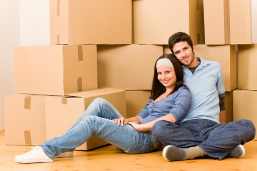 Local Hampstead removals specialists managing boxes and furniture on a residential street