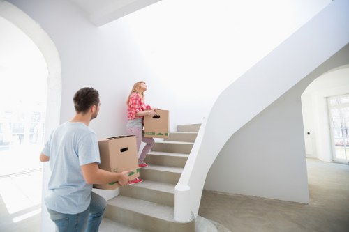 Office furniture and moving equipment prepared for transport in Hampstead