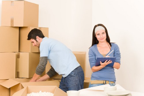Packed boxes and furniture ready for a Hampstead removal van