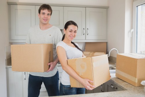 Professional movers loading items for transport near Hampstead